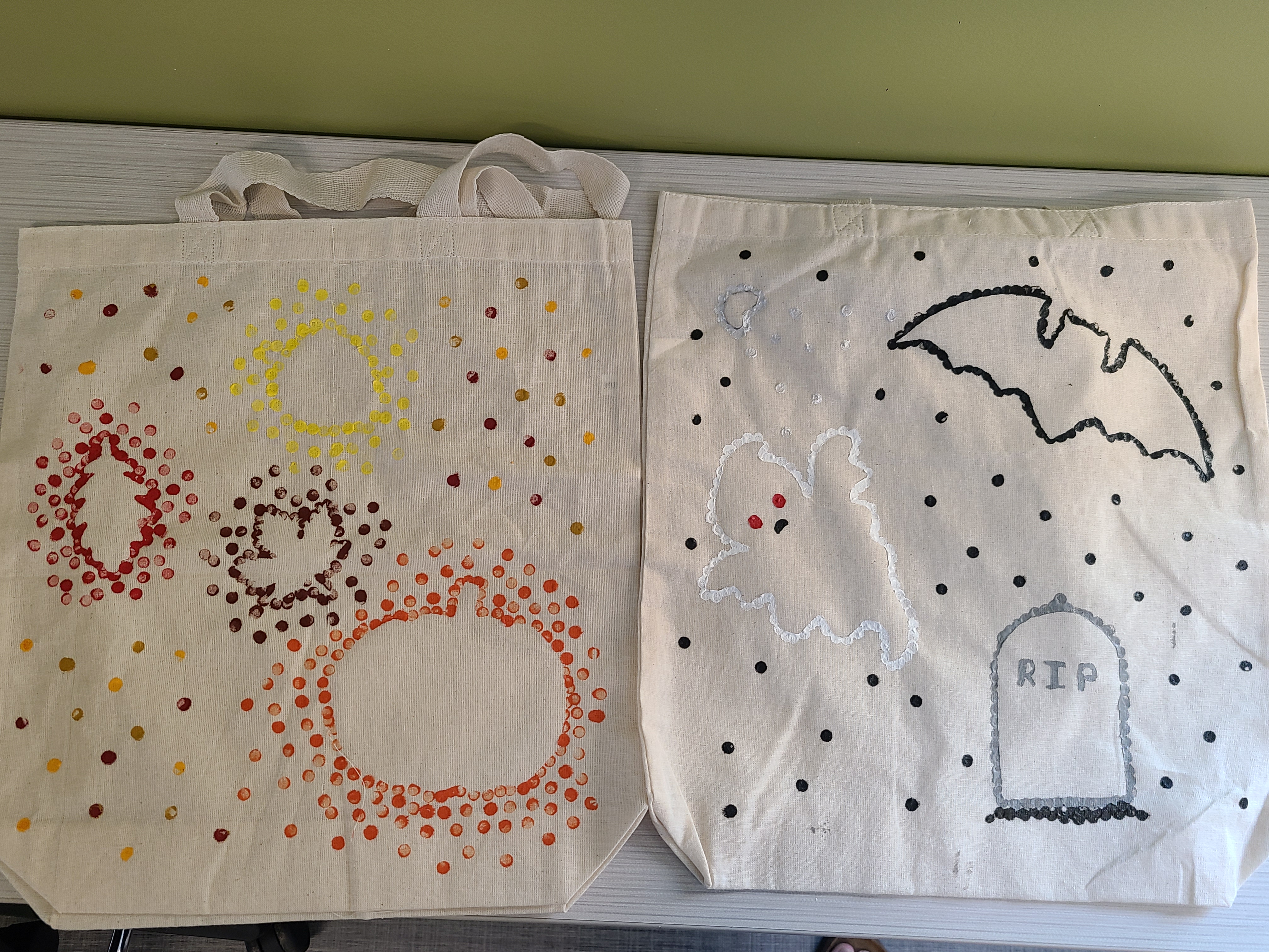 Tote bags with pumpkin and leaf outlines stamped