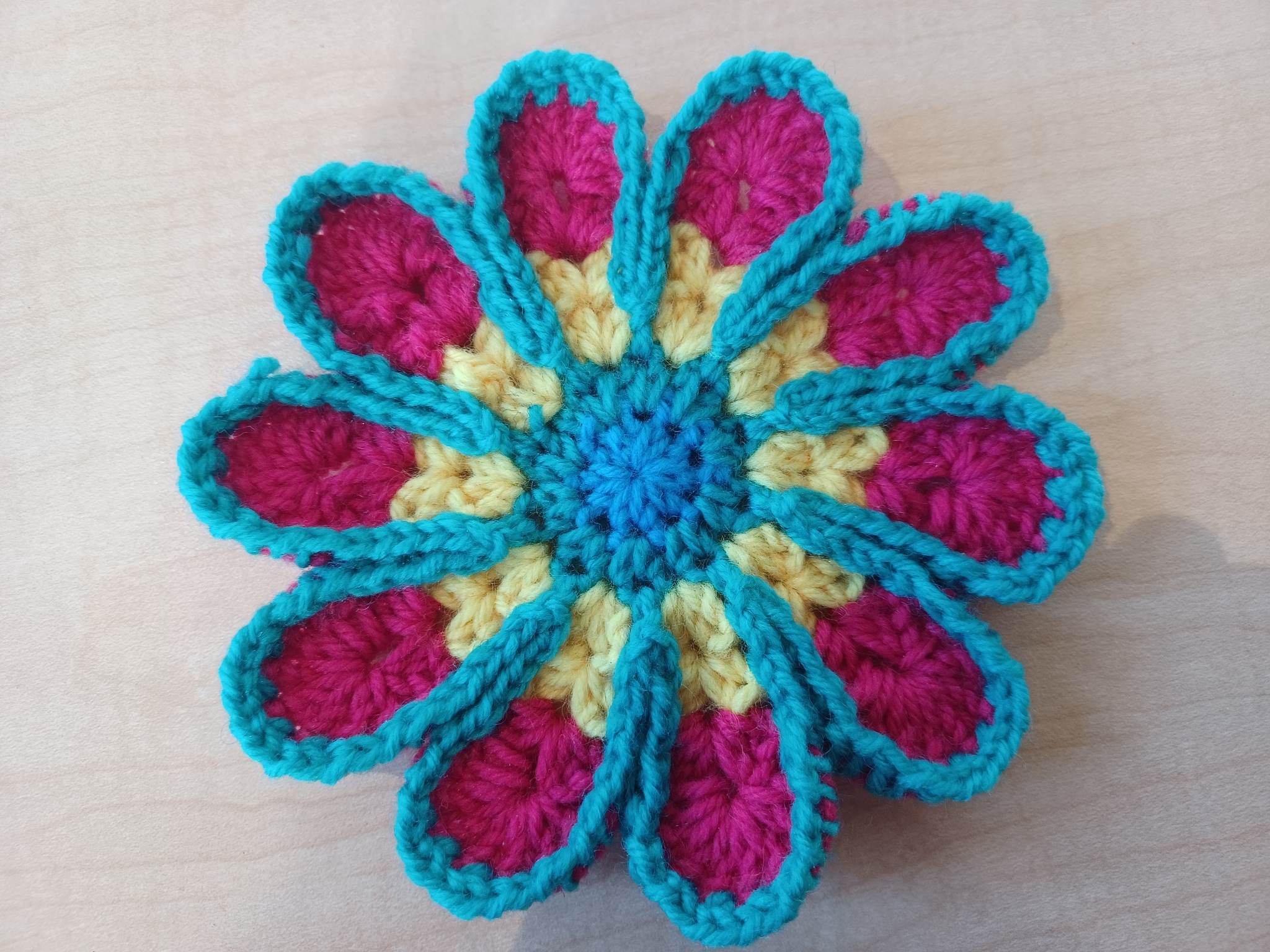 Crocheted flower with multiple colors