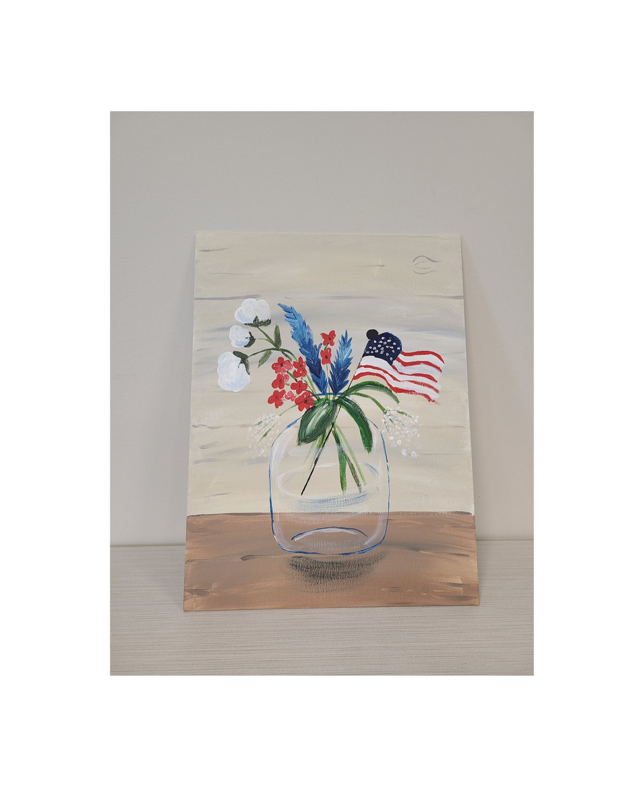 Painting of a jar with small American flag and red, white, and blue flowers