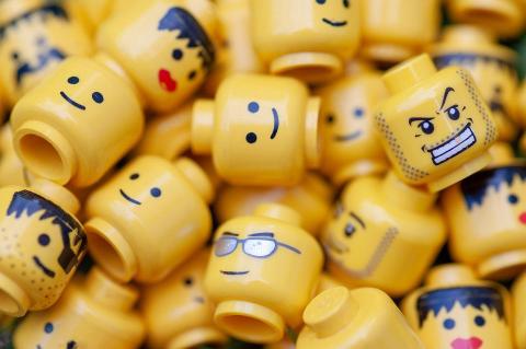 LEGO minifigure heads in a pile