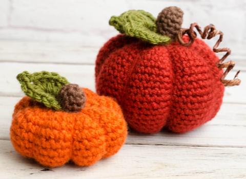 Two crocheted pumpkins