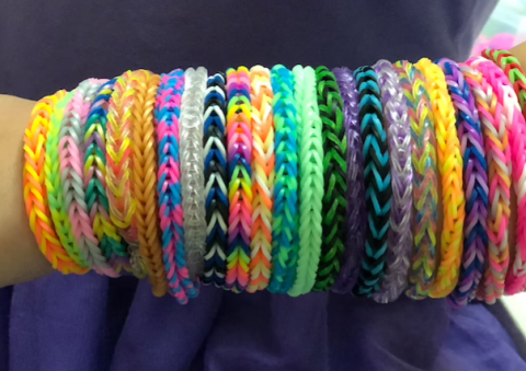 rainbow loom bracelets on a human arm