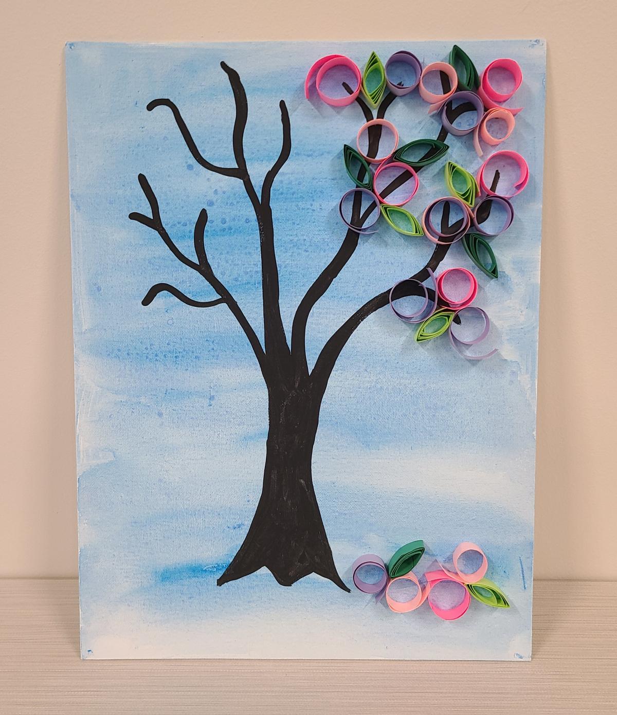 Blue background, tree with paper curls